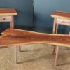 Two walnut end tables and one walnut coffee table